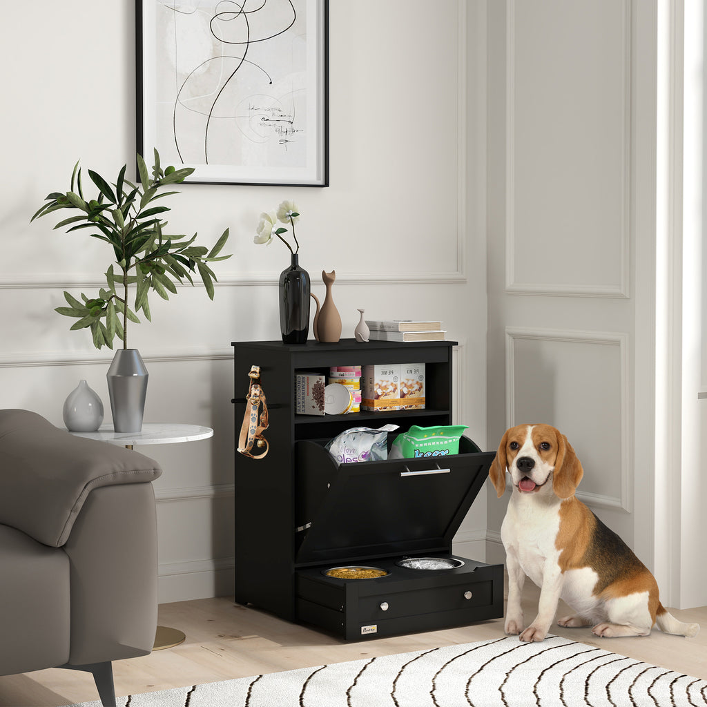 Dog standing next to a black pet station with food and water bowls in a living room.