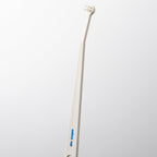 White toothbrush with a curved handle on a light gray background