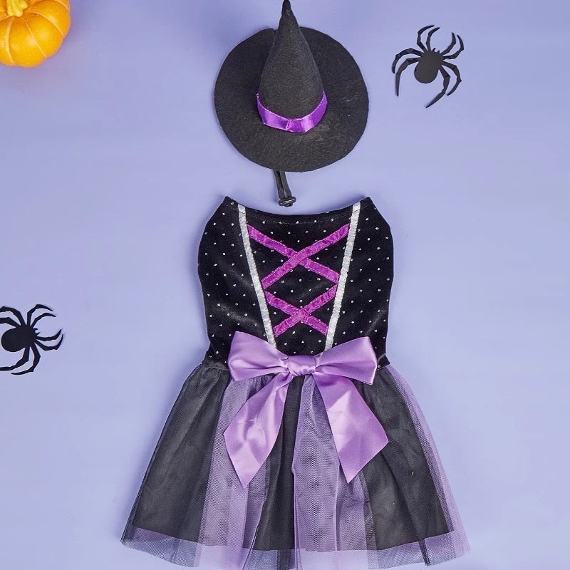 Halloween-themed dress with black and purple details on a light purple background.