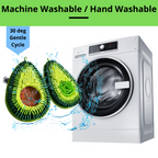 Two avocado dog toys with water splashes next to a washing machine, indicating machine or hand washability.