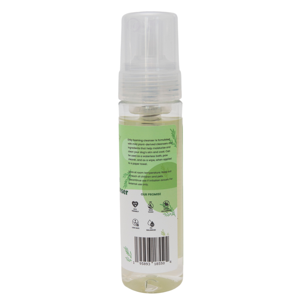 Clear spray bottle with green label on a white background