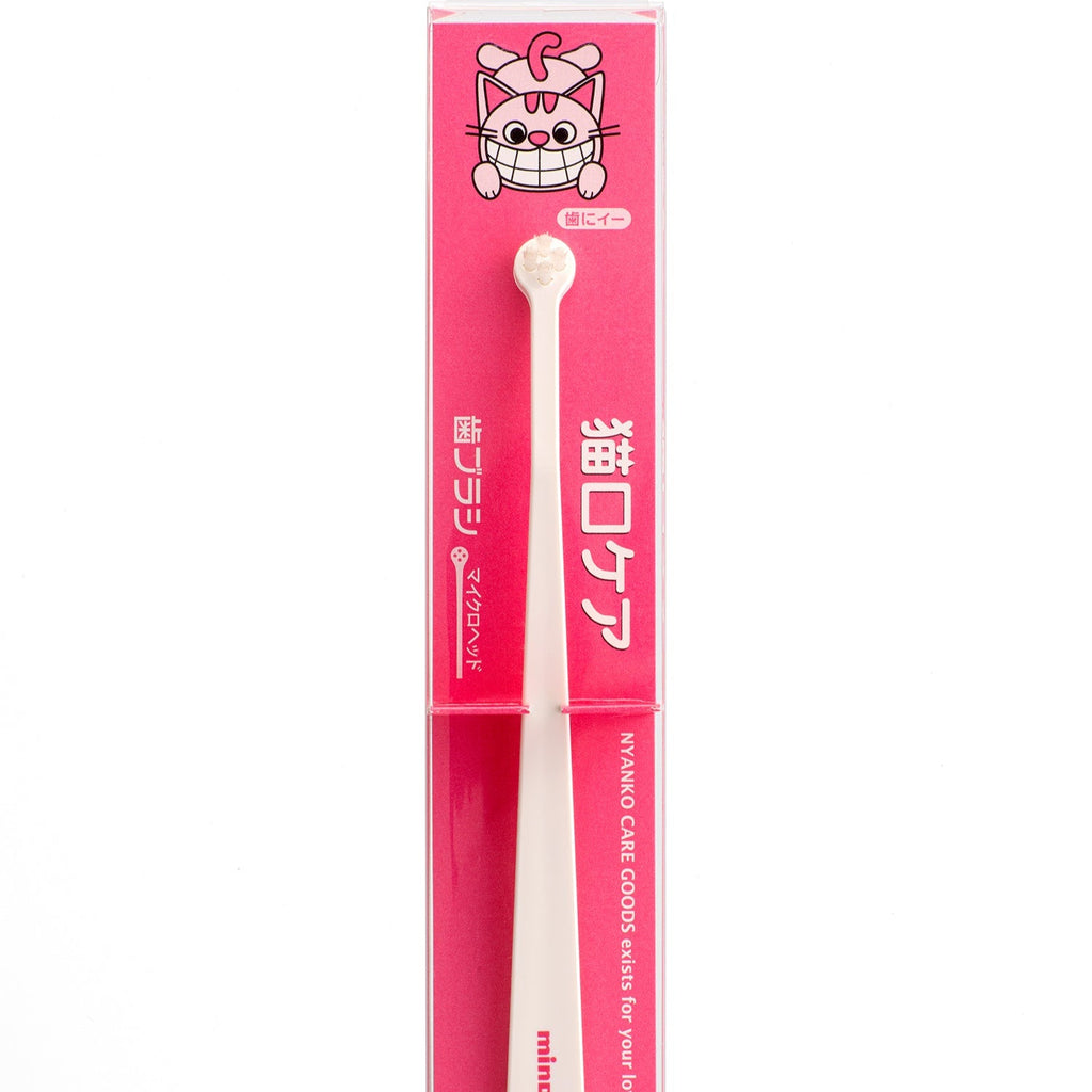 Cat toothbrush with packaging featuring a cartoon cat design on a white background