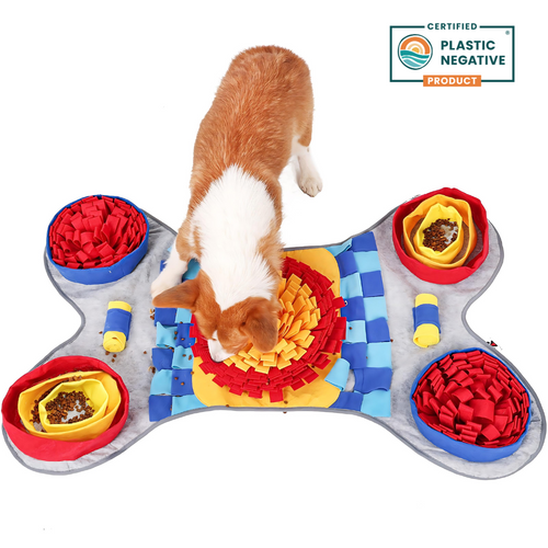 Colorful pet snuffle mat with a dog interacting with it on a white background, featuring a 'Certified Plastic Negative' logo.