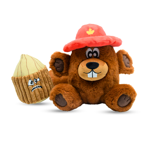 Plush toy bear wearing a red hat with a maple leaf and a shell with a sad face on a white background
