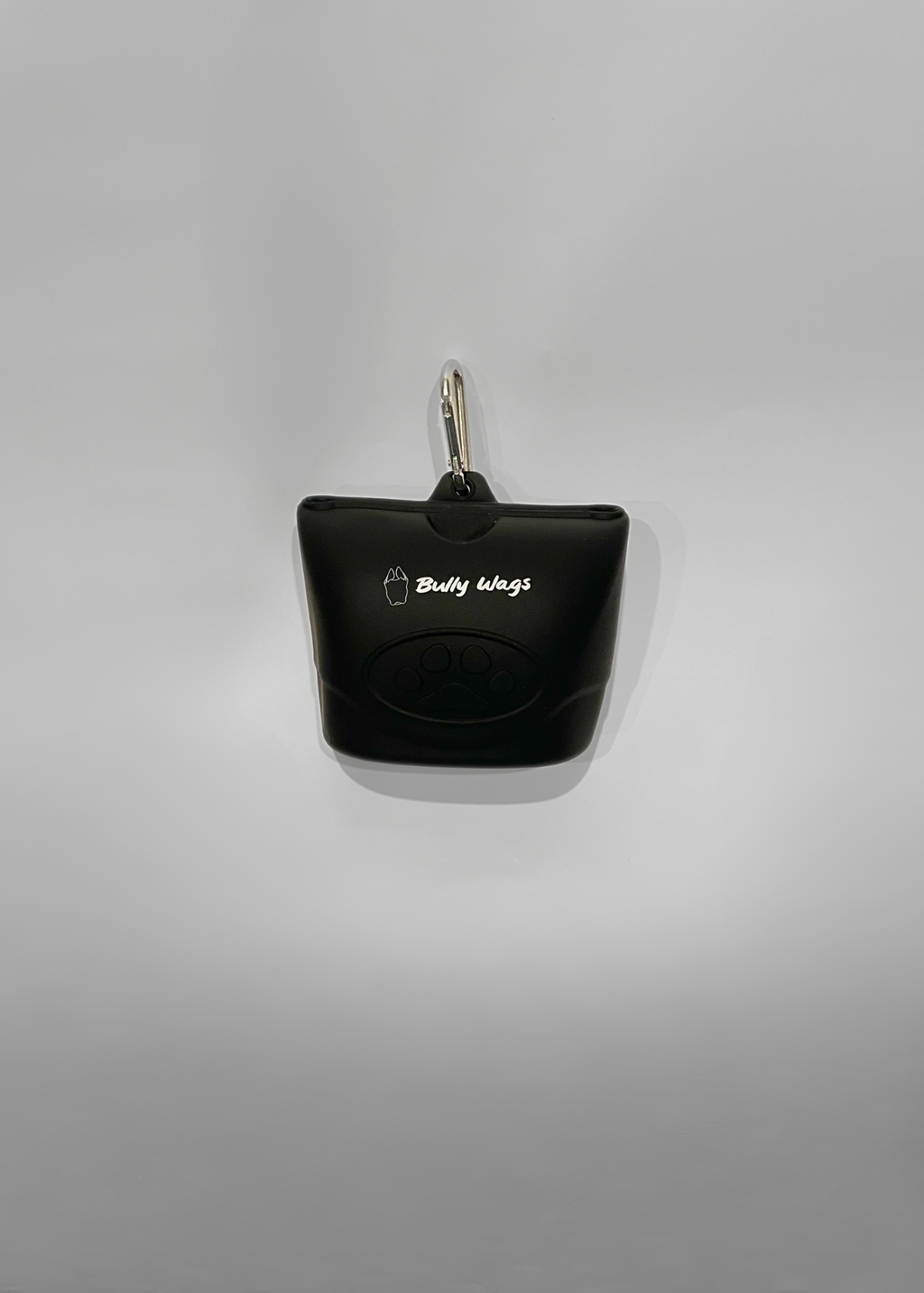 Black treat bag holder with a keychain on a gray background