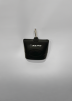 Black treat bag holder with a keychain on a gray background