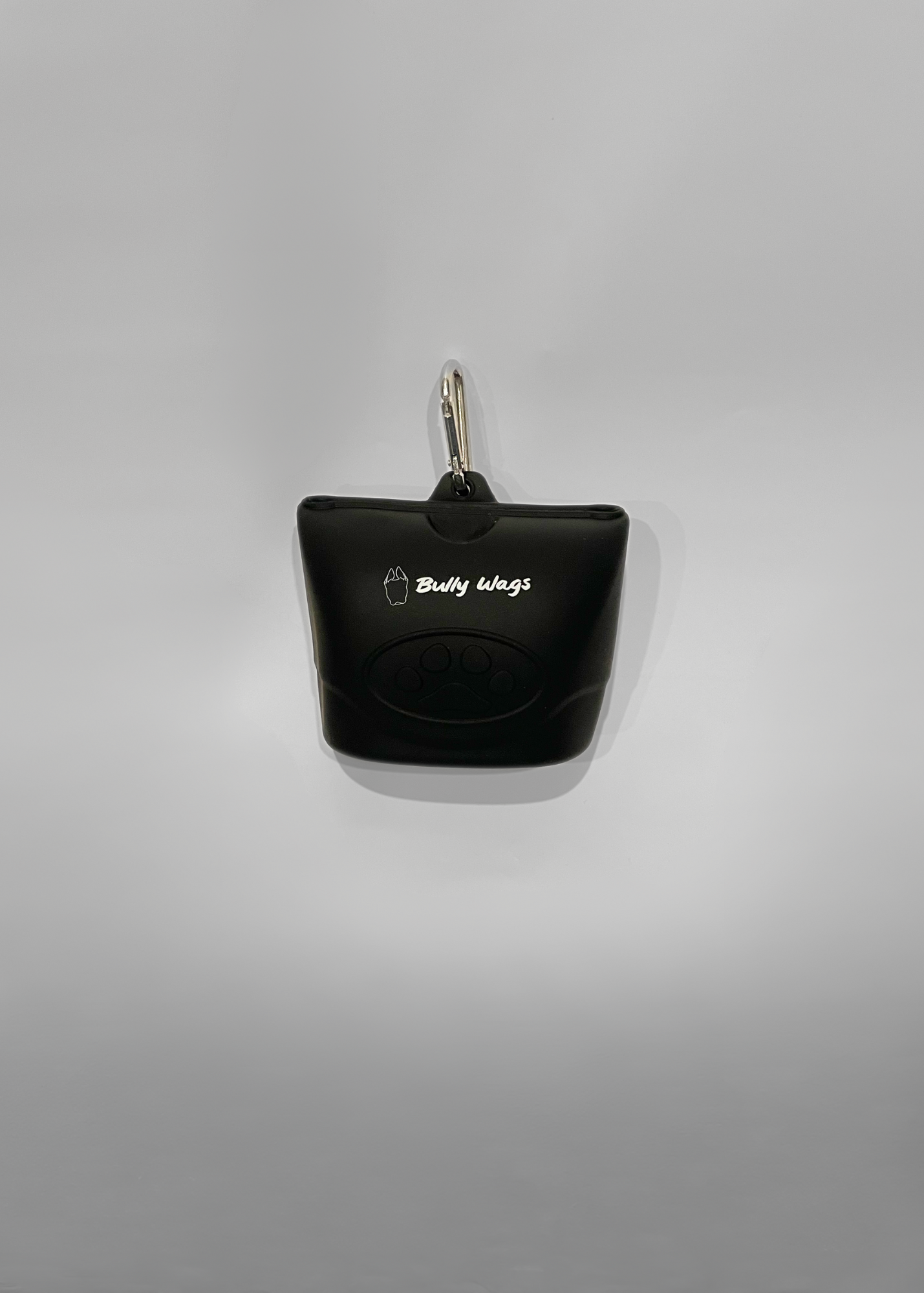 Black treat bag holder with a keychain on a gray background