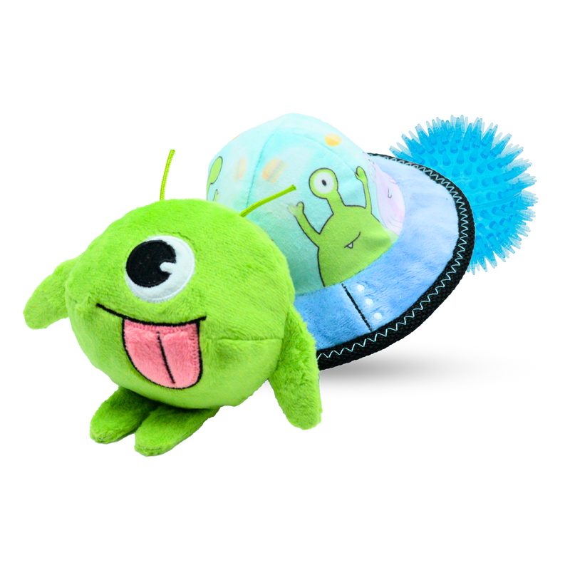 Green dog plush toy with a blue spiky ball and a round blue object with an alien design on a white background.