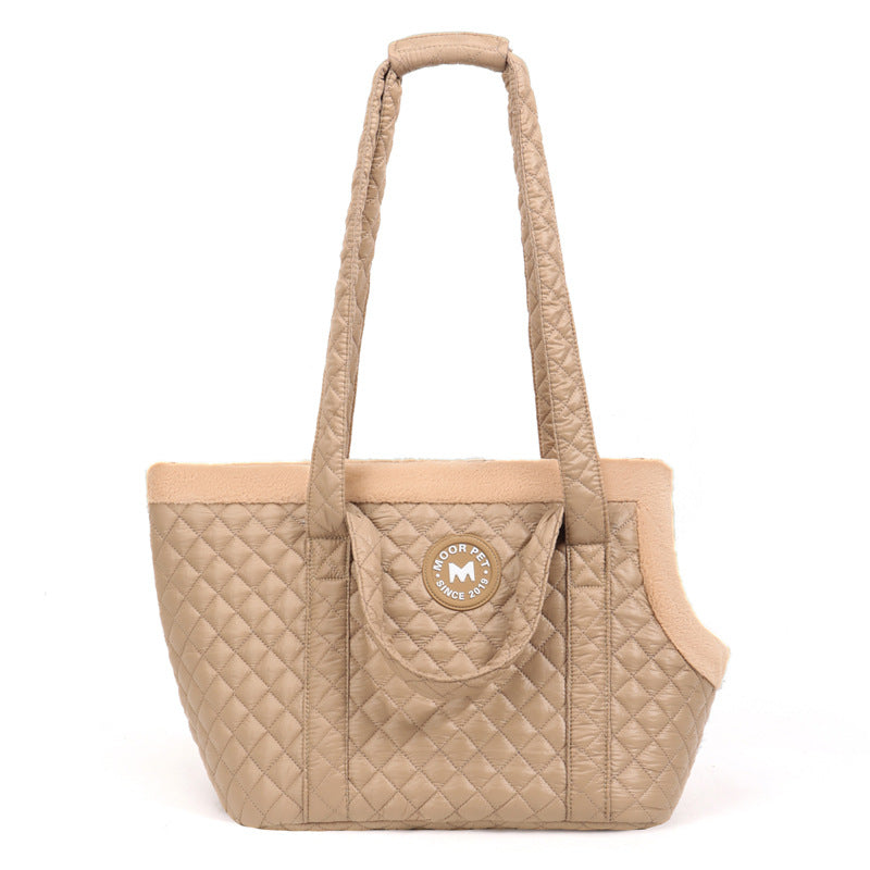 Beige quilted pet carrier with a visible brand logo on a white background