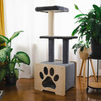 Cat tree with multiple levels and a paw print design in a room with plants and a curtain.