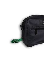 Black bag with a green waste bag on a white background