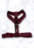 Cherry Wine dog harness on a white marble background