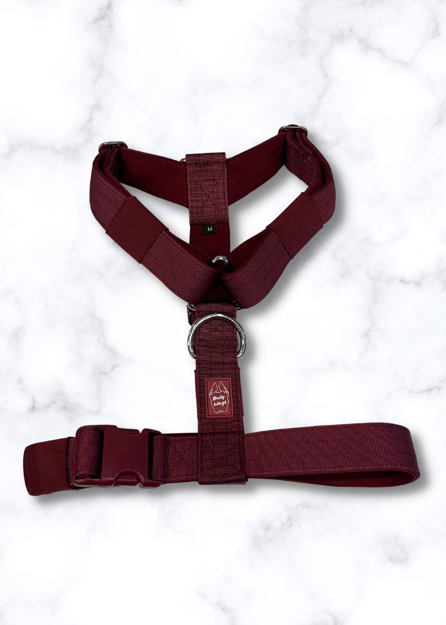 Cherry Wine dog harness on a white marble background