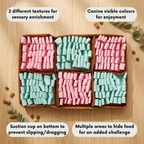 Snuffle mat with pink and green dog treats on a wooden surface
