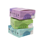 Stack of three boxes with purple, green, and blue lids on a white background