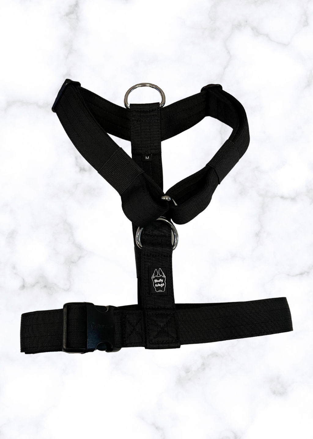 Black harness on a white marble background