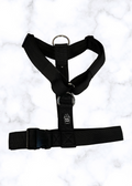 Black harness on a white marble background