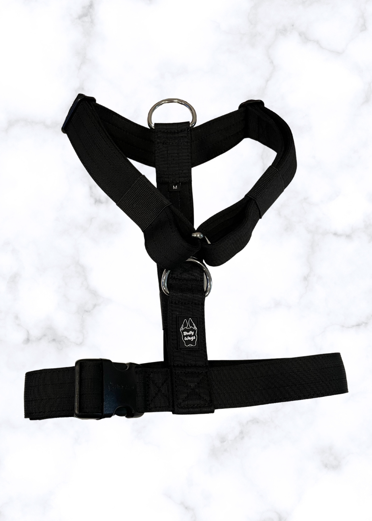 Black harness on a white marble background