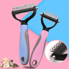 Two pet grooming brushes with black handles and stainless steel teeth are shown on a pink and blue background. One brush has a light blue handle and the other has a pink handle.