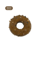 Donut-shaped cat toy with spikes on a white background