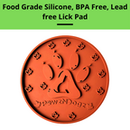 Orange paw-shaped lick pad with 'pawzNdogz' branding on a white background