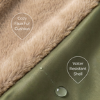 Cozy faux fur cushion with water-resistant shell, showing texture and water droplet on green fabric.