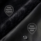 Close-up of a black faux fur cushion with water droplet on a water-resistant shell, labeled 'Cozy Faux Fur Cushion' and 'Water Resistant Shell'.