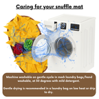 Washing machine with colorful snuffle mat and washing instructions on a white background