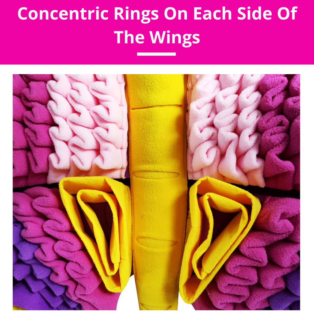 Butterfly made of colorful fabric with concentric rings on each side of the wings.