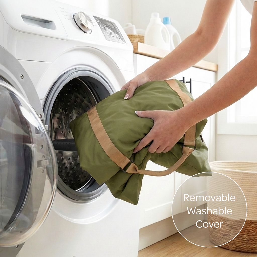 Person placing a green pet car seat cover with a brown strap into a washing machine, with 'Removable Washable Cover' text overlay.