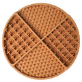 Round kakhi silicone lick mat with textured surface on a white background