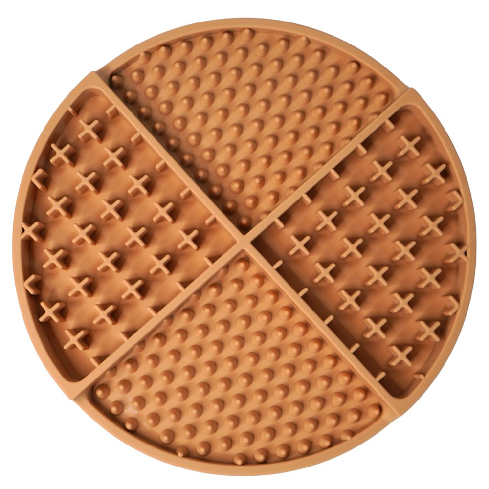 Round kakhi silicone lick mat with textured surface on a white background