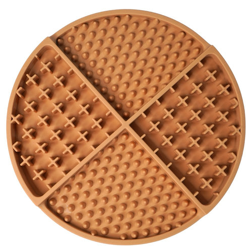 Round kakhi silicone lick mat with textured surface on a white background