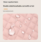 Pink water-repellent fabric with water droplets on a beige background