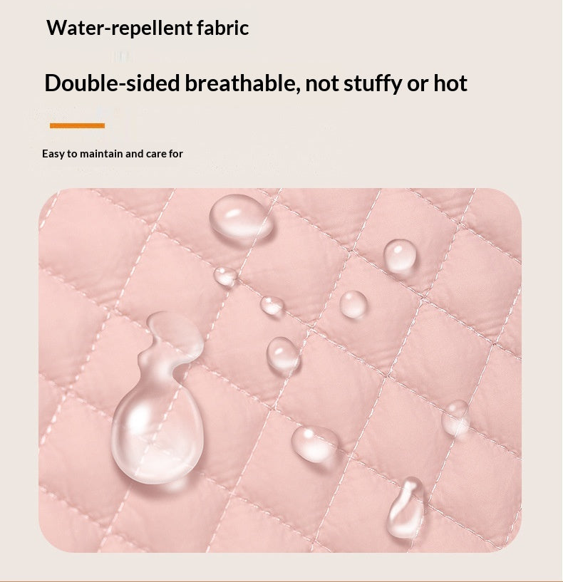Pink water-repellent fabric with water droplets on a beige background