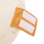 Close-up of a mustard yellow pet halloween costume with white stripes on a white background