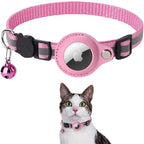 Pink and gray pet collar with a bell and a small round device, worn by a cat.