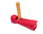 Red dog chew toy with a wooden stick on a white background