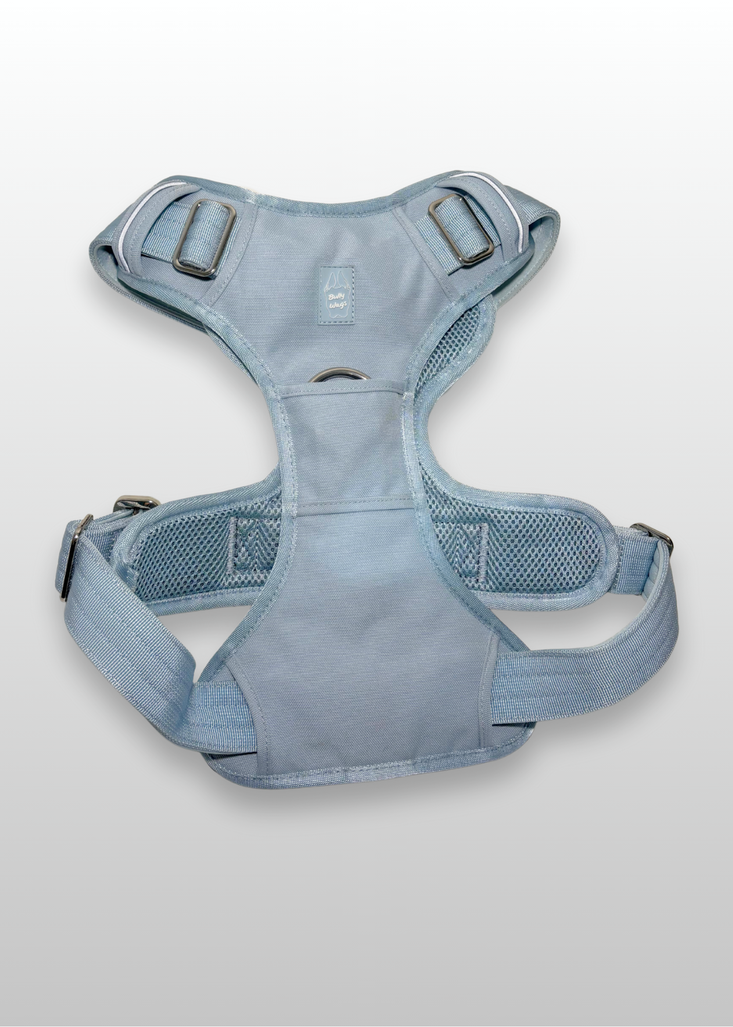 Blue dog harness on a light gray background