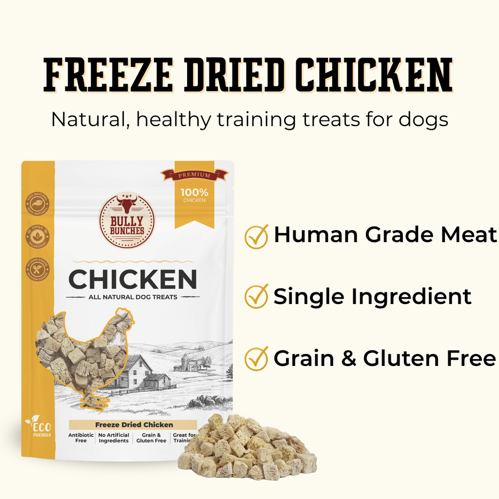 Bully Bunchers Freeze Dried Chicken dog training treats shown in a white and gold pouch with a small pile of the cube-shaped treats displayed in front, on a light cream background with marketing text.