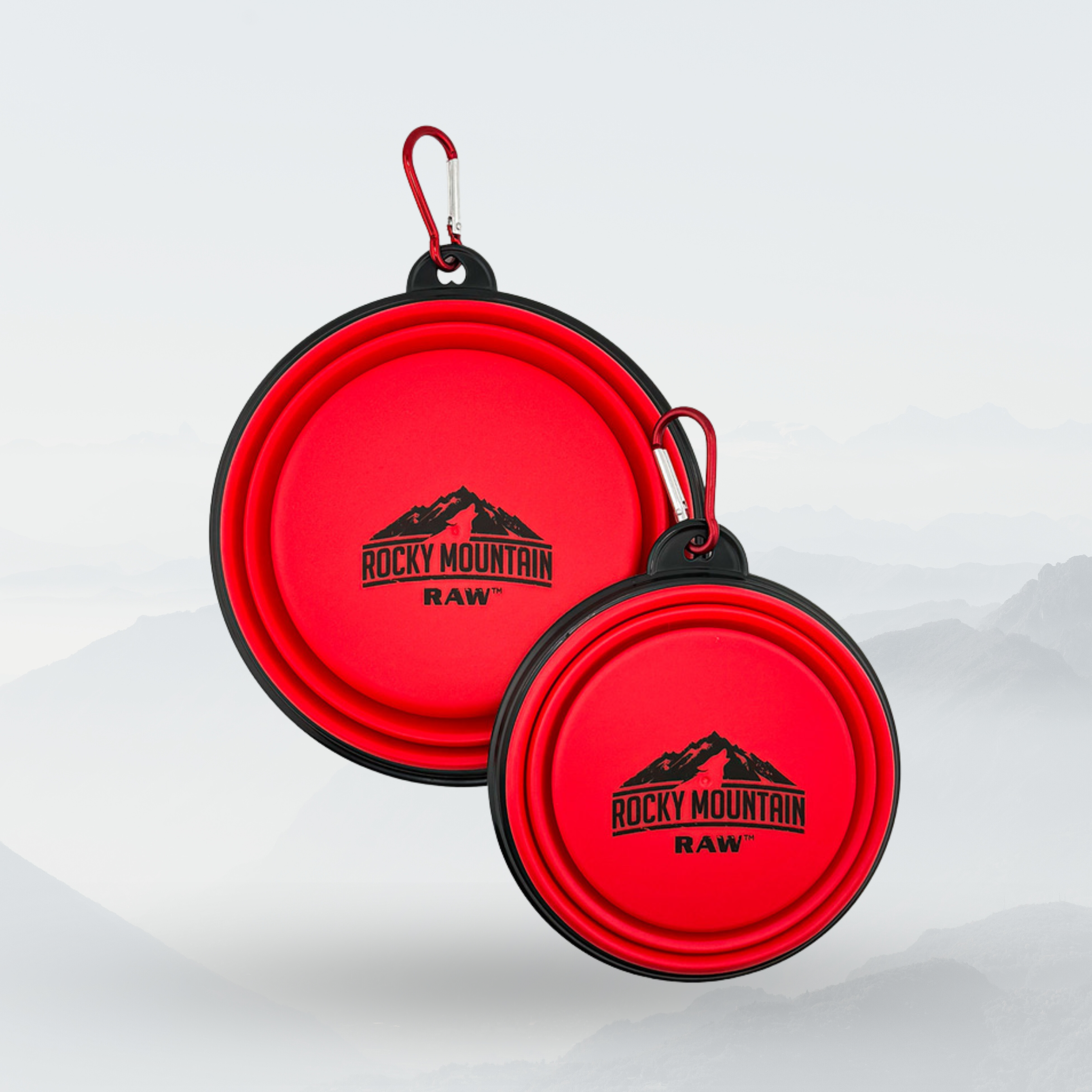 Two red Rocky Mountain Raw pet bowls with carabiners on a white background