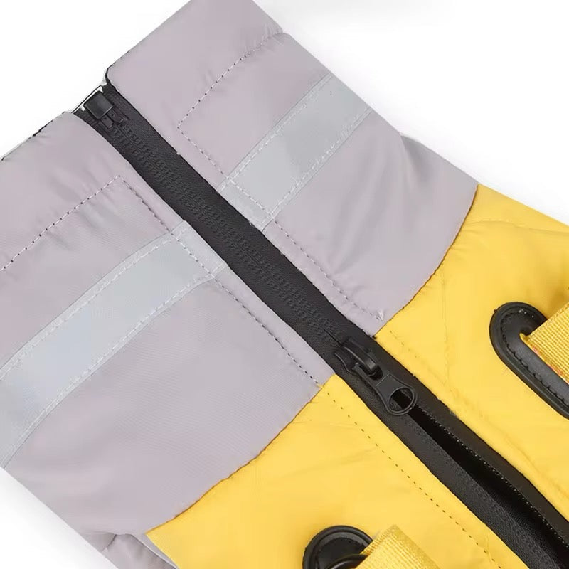 Close-up of a yellow and gray bag with a black zipper.