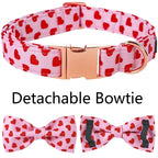 Dog collar with red heart pattern and detachable bowties on a white background