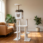 Cat tree with a cat on top in a room with a couch and plants