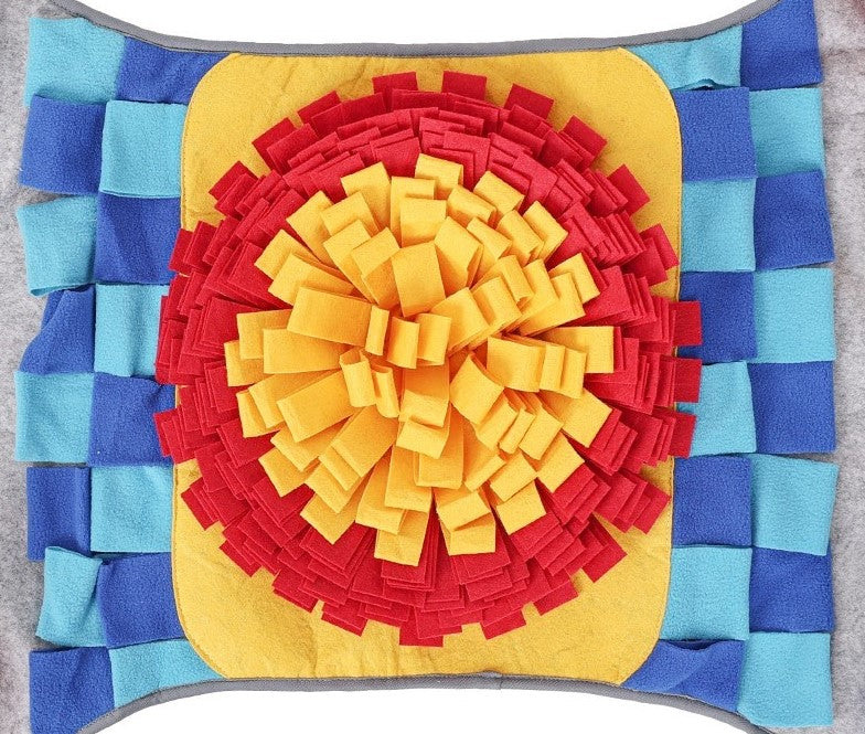 Colorful snuffle mat with concentric circle pattern on a plain background