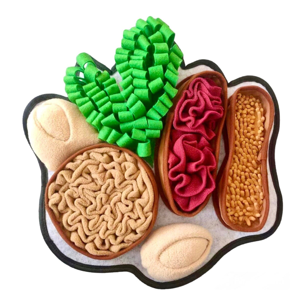 Colorful toy shaped like a paw with various textures and colors on a white background