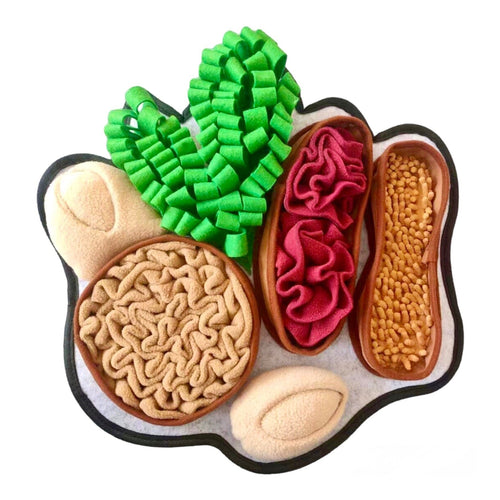 Colorful toy shaped like a paw with various textures and colors on a white background