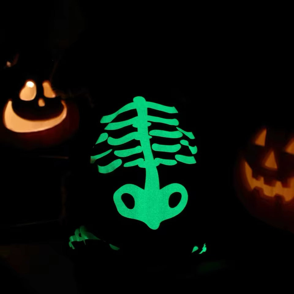 Glowing green skeleton design on a dark background with two jack-o'-lanterns.