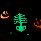 Glowing green skeleton design on a dark background with two jack-o'-lanterns.