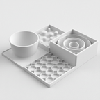 A white slow feeder set on a light gray background, featuring a bowl, a tray with small raised spheres, a spiral insert, and a hexagonal grid mat.